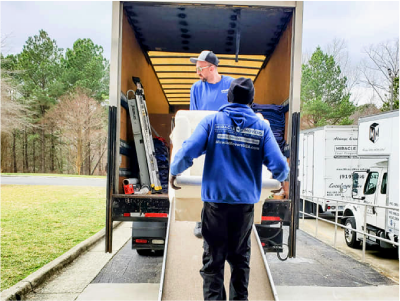 An image of Miracle Movers loading items in the truck